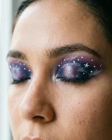 AI-generated reference for the Galaxy eyes idea: purple and blue eyelids dotted with small white stars